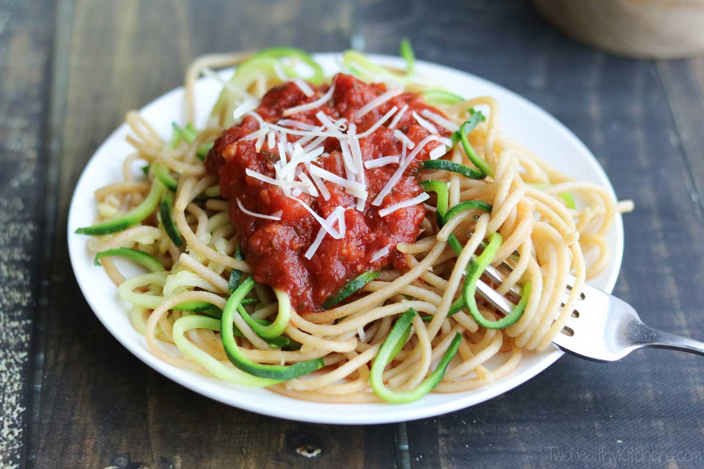 Top your zoodle and spaghetti mixture with your favorite pasta sauce, and even add a bit of shredded cheese. In minutes, dinner is served! A 15-minute meal you can feel great serving your family!